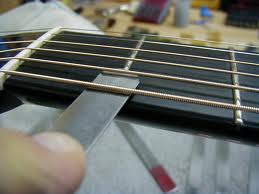 replace guitar nut measure string height