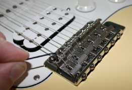 adjusting action on guitar